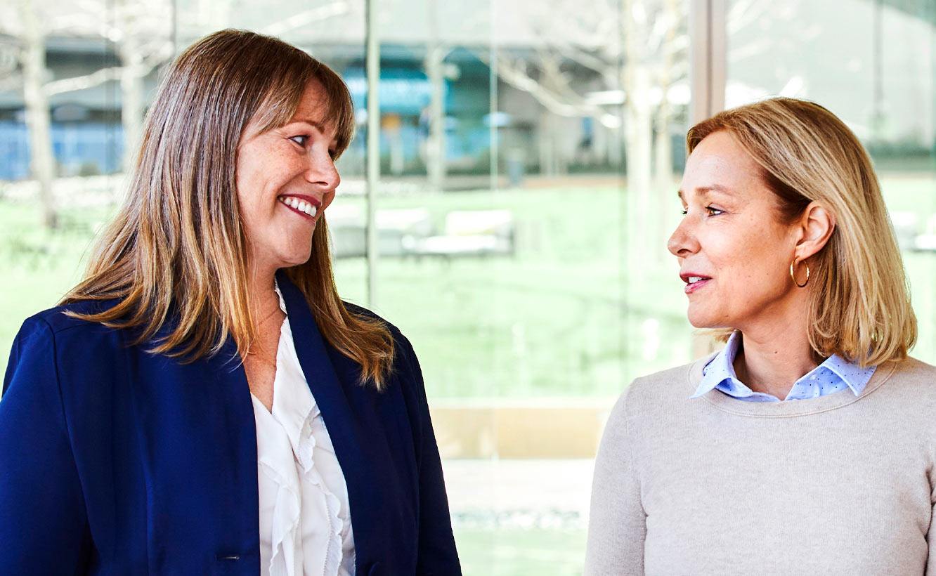 Two female professionals talking